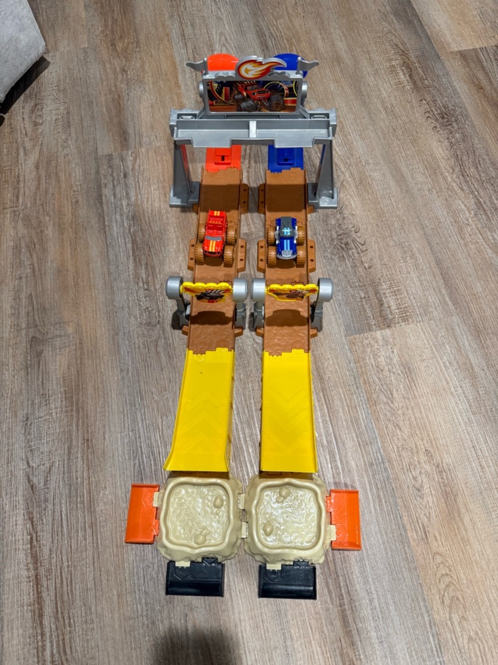 Fisher-Price Dual Track Race Set with Yellow Lanes and Red & Blue Cars